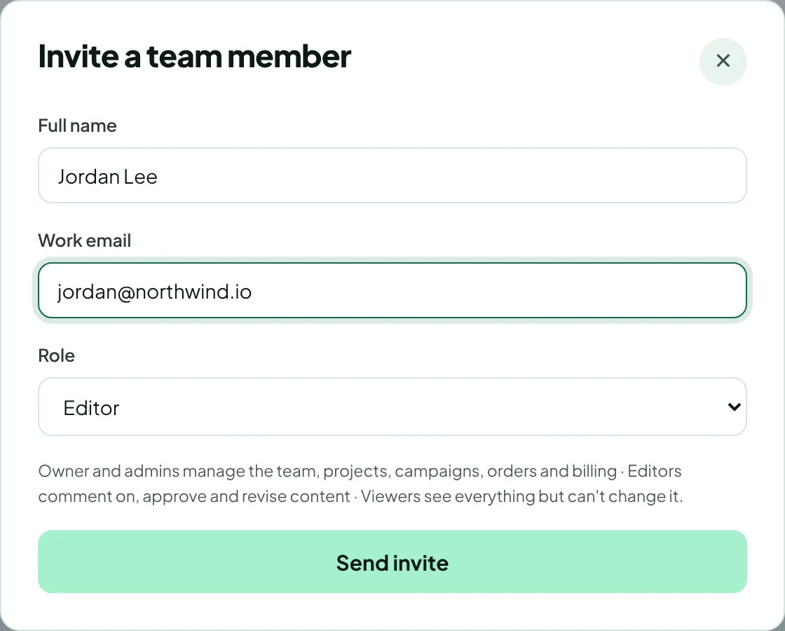 The Invite a team member dialog with full name, work email and role